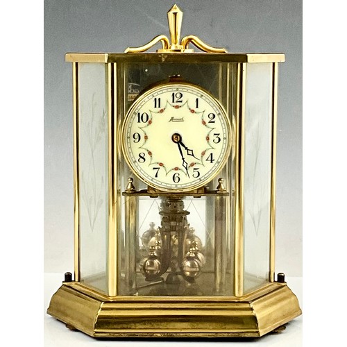 299 - VINTAGE ANNUAL BRASS & GLASS CASED TORSION CLOCK