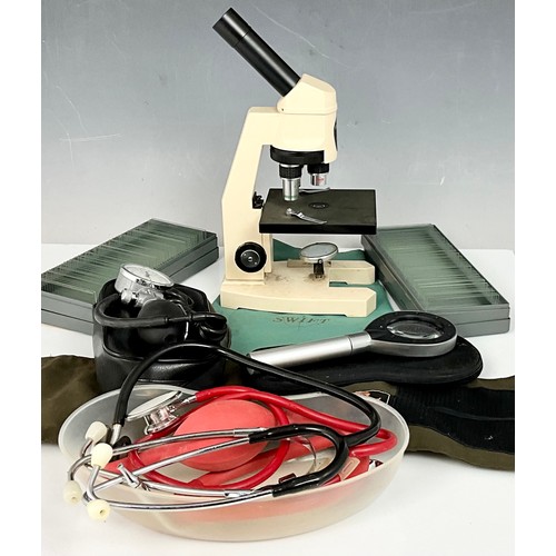 435 - 1980’S SWIFT M250 SERIES MICROSCOPE INC. SLIDES, MAGNIFYING GLASS WITH LIGHT AND MISC. MEDICAL ITEMS... 