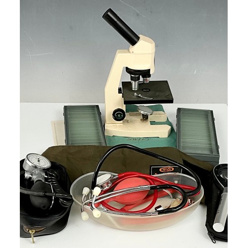 435 - 1980’S SWIFT M250 SERIES MICROSCOPE INC. SLIDES, MAGNIFYING GLASS WITH LIGHT AND MISC. MEDICAL ITEMS... 