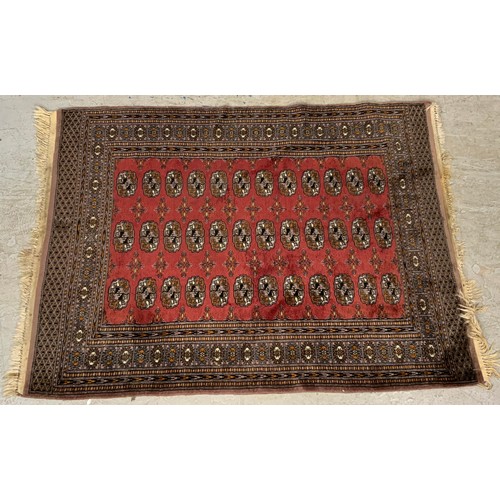 1056 - RED  GROUND RUG 180cm x 133cm