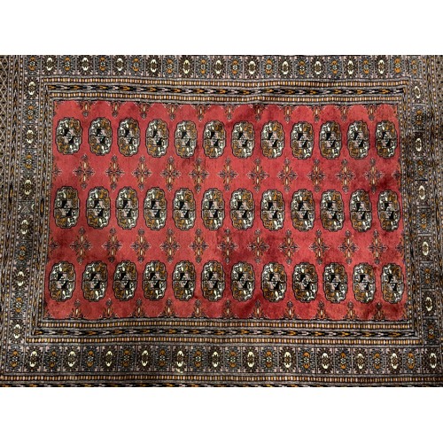 1056 - RED  GROUND RUG 180cm x 133cm