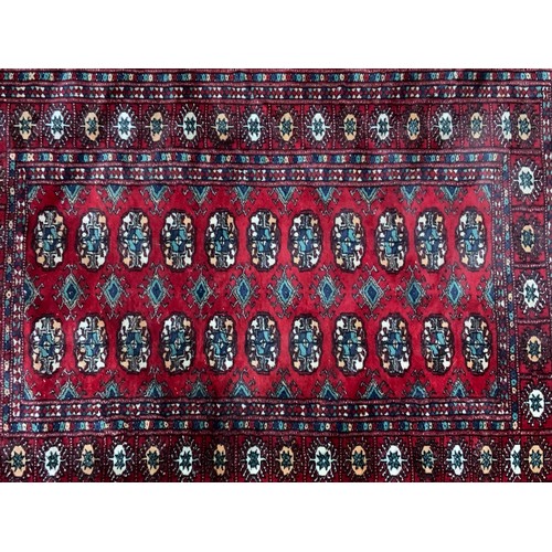 1057 - RED GROUND RUG 146cm x 95cm