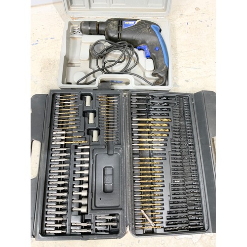 571 - 3 BOXED ELECTRIC DRILLS, HITACHI, WICKES , NUTOOL & A  CASE OF VARIOUS DRILL BITS