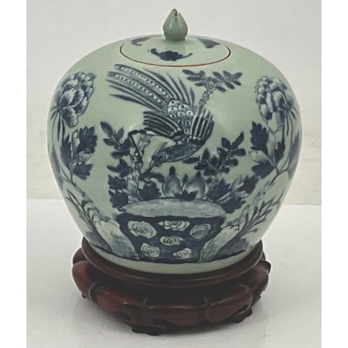 65 - BLUE AND WHITE BALUSTER JAR WITH COVER ON HARDWOOD STAND