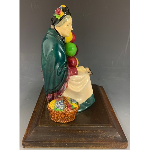 39 - RARE ROYAL DOULTON BALLOON SELLER FIGURINE WITH BULL DOG ON WOODEN PLINTH  23cm TALL