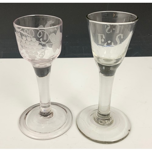 76 - 18TH DRINKING GLASS HAVING AN OGEE BOWL WITH ENGRAVED VINE LEAF DECORATION ON A PLAIN STEM WITH FOLD... 