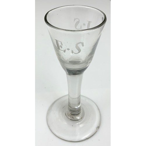 76 - 18TH DRINKING GLASS HAVING AN OGEE BOWL WITH ENGRAVED VINE LEAF DECORATION ON A PLAIN STEM WITH FOLD... 