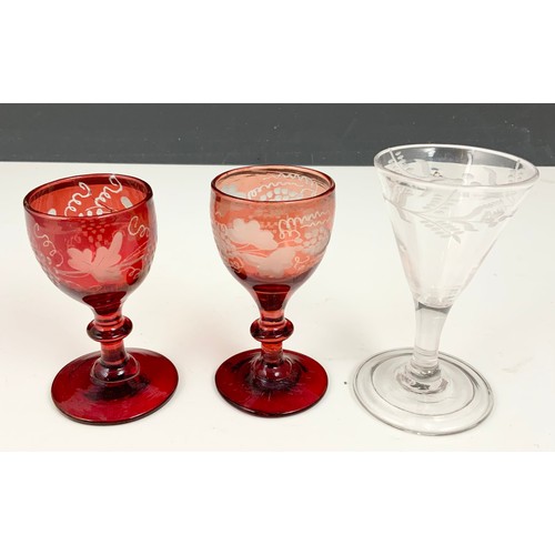 80 - TWO RUBY GLASSES WITH FLASHED VINE LEAF DECORATION TOGETHER WITH AN 18TH CENTURY GLASS WITH CONICAL ... 