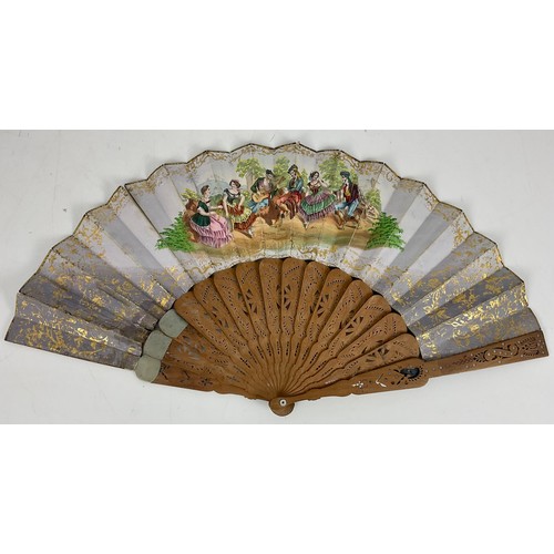 150 - HAND PAINTED PAPER FAN DEPICTING CARD PLAYING SCENE WITH MINSTRELS AND DANCERS VERSO, PIERCED WOODEN... 