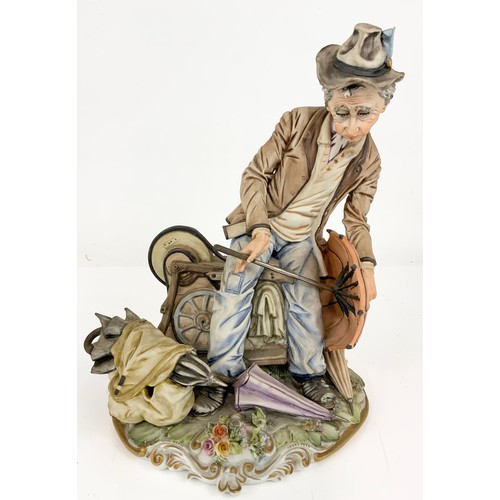 160 - LARGE CAPODIMONTE FIGURINE MAN REPAIRING UMBRELLAS 29cm TALL