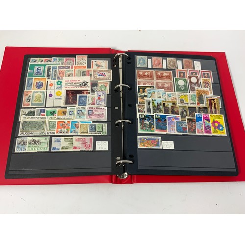 465 - RED PADDED STOCKBOOK WITH UM/M/U COLLECTORS DUPLICATES. INTEREST IN SOUTH AMERICA (M) CUT £250+ AND ... 