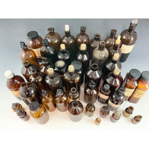 334 - LARGE QUANTITY OF ANTIQUE/ VINTAGE BROWN GLASS CHEMIST BOTTLES/ JARS ADVISED FROM MANDERS OF MALVERN... 