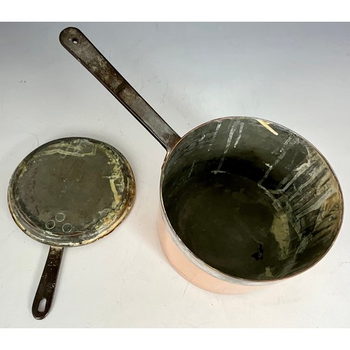 THREE ANTIQUE COPPER AND BRASS SAUCEPANS WITH SKILLET LIDS
