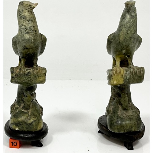 470 - PAIR OF CARVED JADE BIRDS AF ON WOOD BASES. HEIGHT OF BASE 2cm, HEIGHT OF EACH BIRD APPROX. 18cm