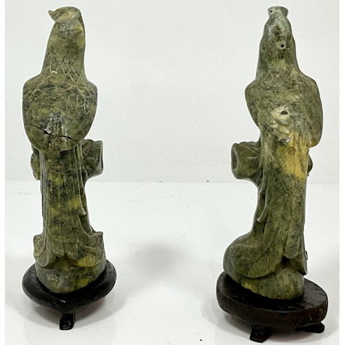 470 - PAIR OF CARVED JADE BIRDS AF ON WOOD BASES. HEIGHT OF BASE 2cm, HEIGHT OF EACH BIRD APPROX. 18cm