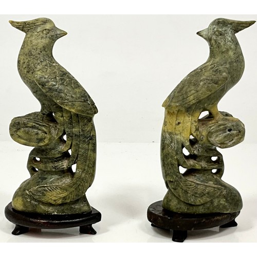 470 - PAIR OF CARVED JADE BIRDS AF ON WOOD BASES. HEIGHT OF BASE 2cm, HEIGHT OF EACH BIRD APPROX. 18cm