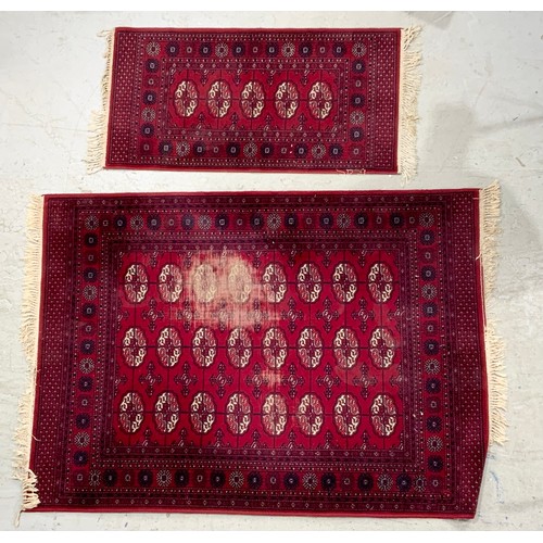 789 - TWO RED GROUND RUGS LARGEST 195cm x 140cm