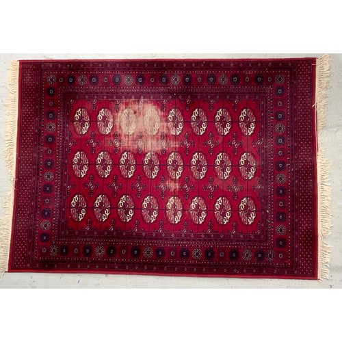 789 - TWO RED GROUND RUGS LARGEST 195cm x 140cm