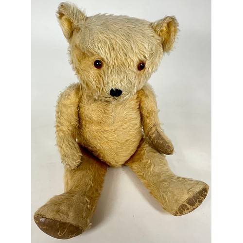 54 - VINTAGE TEDDY, MOVING JOINTS AND STITCHED NOSE. APPROX. LENGTH 60cm