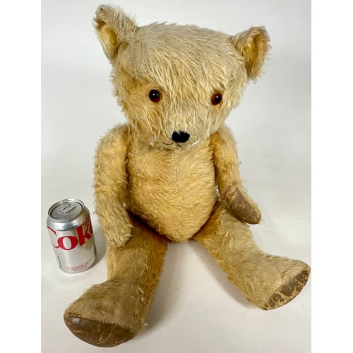 54 - VINTAGE TEDDY, MOVING JOINTS AND STITCHED NOSE. APPROX. LENGTH 60cm