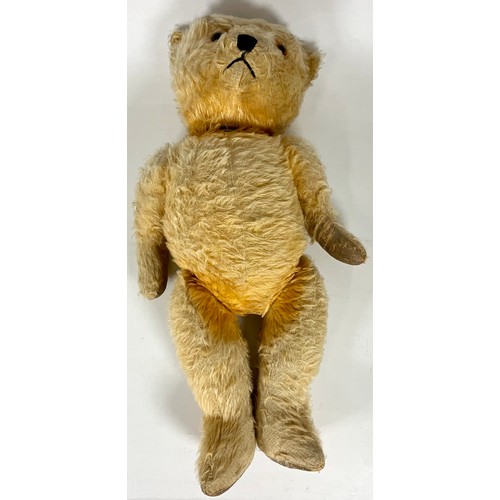 54 - VINTAGE TEDDY, MOVING JOINTS AND STITCHED NOSE. APPROX. LENGTH 60cm