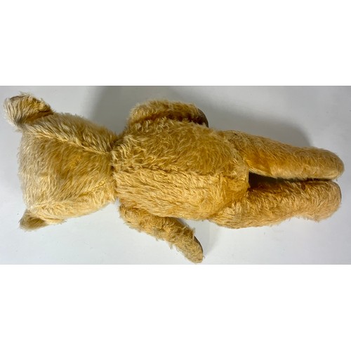 54 - VINTAGE TEDDY, MOVING JOINTS AND STITCHED NOSE. APPROX. LENGTH 60cm