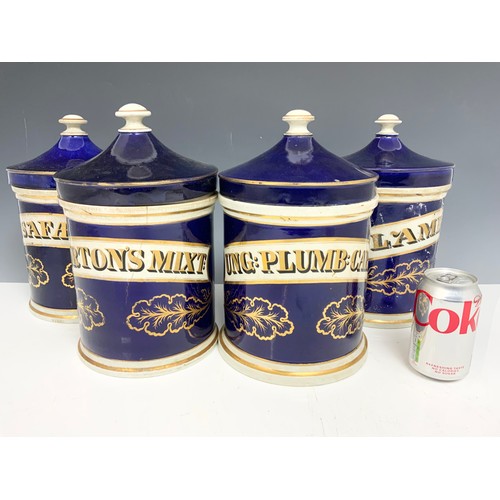 270 - 4 LARGE DRUG / CHEMIST JARS  WITH COVERS COLBALT BLUE WITH GILT  DECORATION 30cm TALL ADVISED FROM M... 