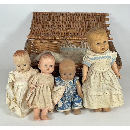 453 - 4 VINTAGE DOLLS IN A WICKER BASKET