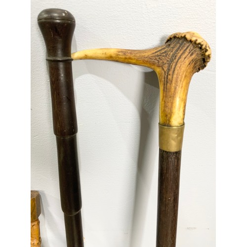 461 - 2 SWAGGER STICKS, 2 WALKING STICKS , VINTAGE UMBRELLA  &  A UNUSUAL  VINTAGE BOARD FOR TAILORING