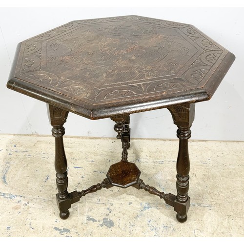 761 - OCTAGONAL CARVED TABLE WITH TURNED SUPPORTS, CROSS STRETCHERS AND UNDER TIER