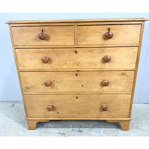 719 - VICTORIAN PINE CHEST OF TWO OVER THREE DRAWERS WITH TURNED HANDLES ON BRACKET FEET