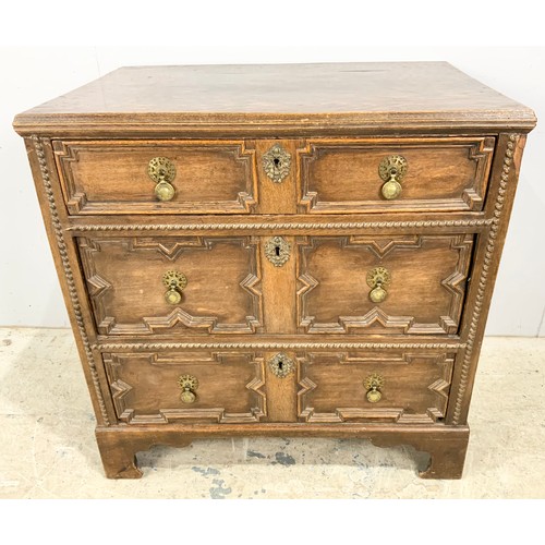 724 - OAK CHEST OF THREE LONG DRAWERS WITH GEOMETRIC MOULDINGS ON BRACKET FEET WIDTH 80cm