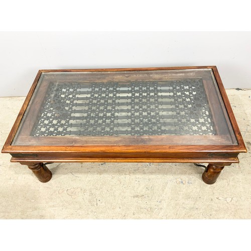 714 - COFFEE TABLE WITH CAST IRON BASE & GLASS TOP 110cm x 60cm