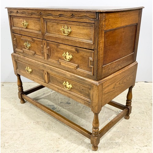 718 - OAK CHEST OF 2 OVER 2 WITH GEOMETRIC MOULDINGS ON STAND WIDTH 102cm