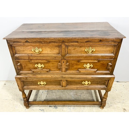 718 - OAK CHEST OF 2 OVER 2 WITH GEOMETRIC MOULDINGS ON STAND WIDTH 102cm