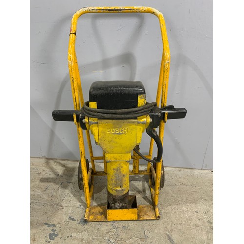 564 - BOSCH CONCRETE BREAKER ON TROLLEY WITH ACCESSORIES