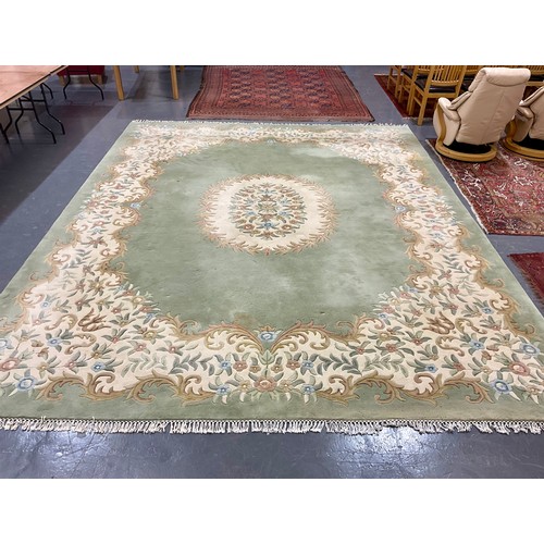 808 - VERY LARGE GREEN GROUND WOOL RUG, APPROX. 460 X 365 cm