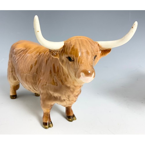 127 - BESWICK MODELS OF A HIGHLAND BULL & A HIGHLAND COW