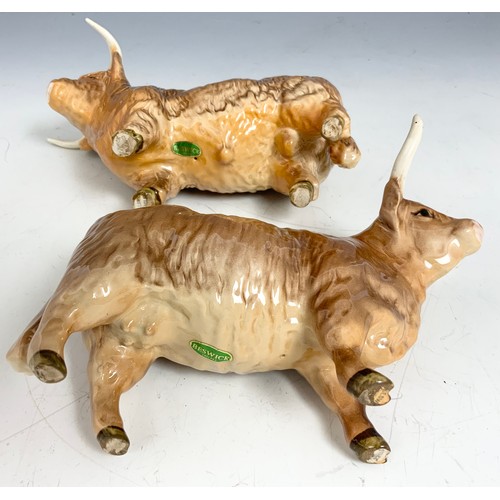 127 - BESWICK MODELS OF A HIGHLAND BULL & A HIGHLAND COW