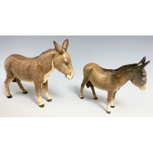 131 - TWO BESWICK DONKEYS