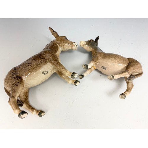 131 - TWO BESWICK DONKEYS