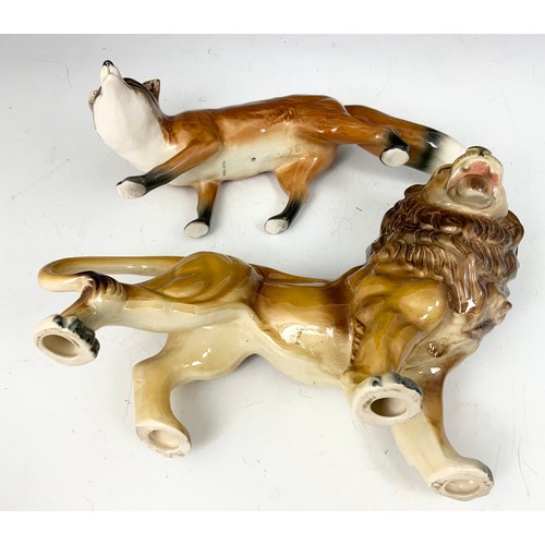 138 - LARGE  PORCELAIN MODEL OF A LION & A STANDING FOX