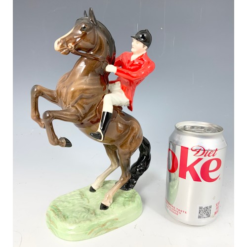 132 - BESWICK MODEL OF A HUNTSMAN ON REARING HORSE MODEL 868 25cm TALL