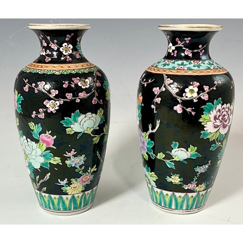 228 - 2 SIMILAR VINTAGE HAND PAINTED ORIENTAL BALUSTER VASES WITH PEACOCKS, FLOWERS AND BLOSSOM