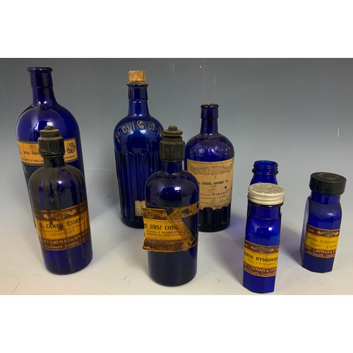 318 - COLLECTION OF BLUE & BROWN GLASS CHEMIST / APOTHECARY BOTTLES/ JARS ADVISED FROM MANDRRS CHEMIST MAL... 