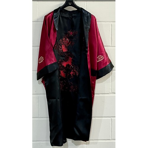 435 - KIMONO, A REVERSABLE BLACK 7 RED KIMONO WITH DRAGON DESIGN