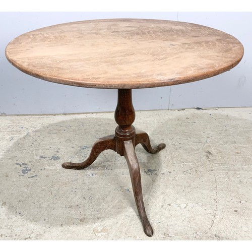 649 - ANTIQUE OAK TILT TOP TABLE. ON TRIPOD BASE 79cm DIAMETER