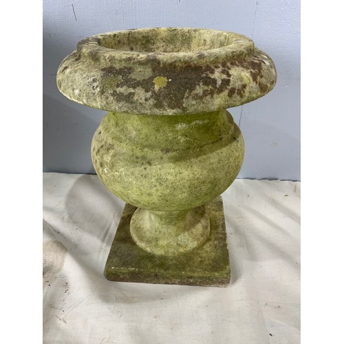 596 - 3 ANTIQUE WEATHERED GRADUATED COMPOSITE GARDEN URNS. TALLEST APPROX. 32cm