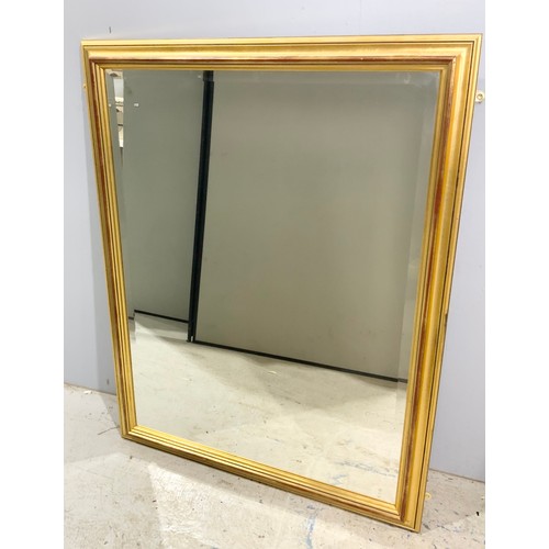 70 - 2 GILT FRAMED MIRRORS LARGEST 100cm x 74cm