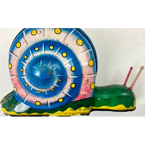 201 - MISC. TIN PLATE TOYS INC. CLOCKWORK MODEL OF A FAIRGROUND RIDE, FRICTION SNAIL, HUMMING SPINNING TOP... 